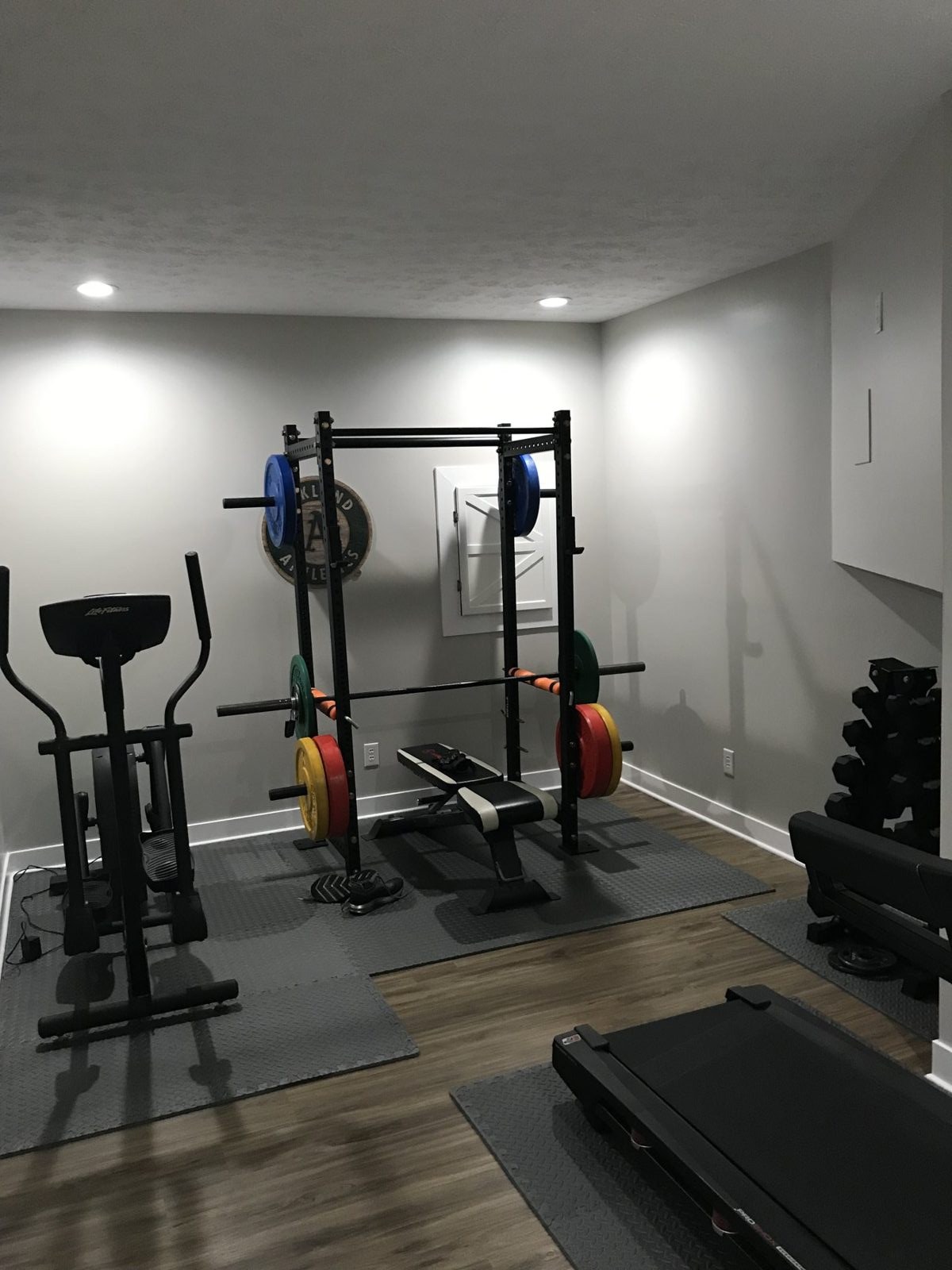 Finished garage with wall mounted storage and equipment racks